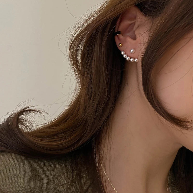 “New imitation pearl stud earrings with geometric crystal zircon stars, perfect for parties.”