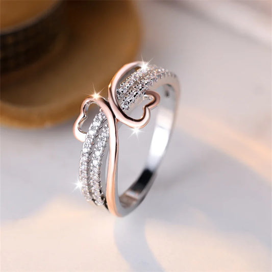 “Two-tone double heart ring, rose gold and silver, white zircon, perfect bridal jewelry.”