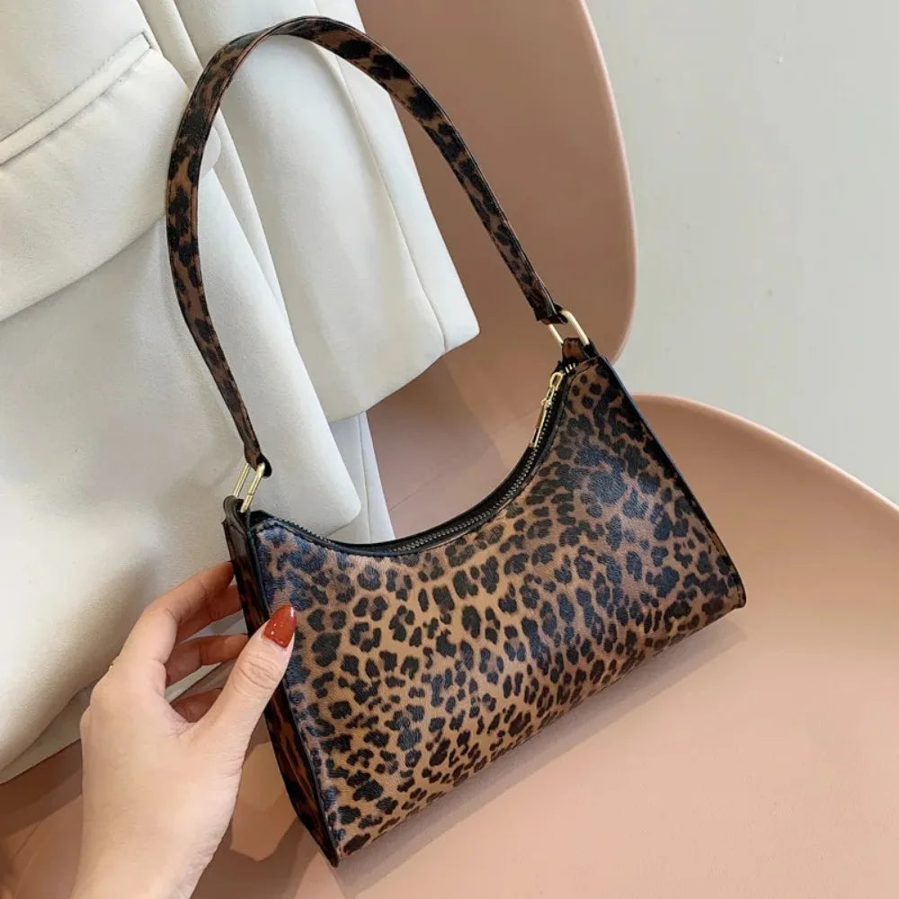 “Trendy zebra-print shoulder bag, PU leather, chic design, perfect summer accessory.”
