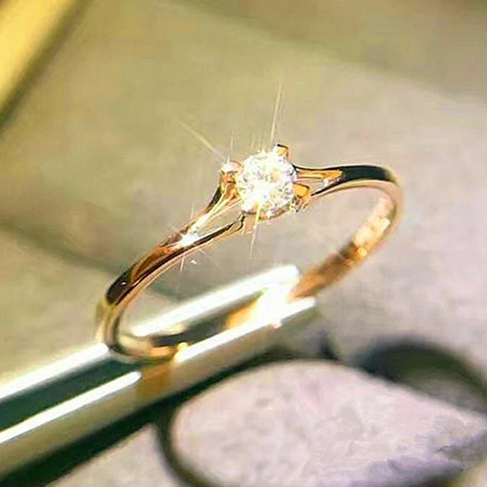 “Minimalist wedding ring with 4MM cubic zirconia, simple and elegant design.”