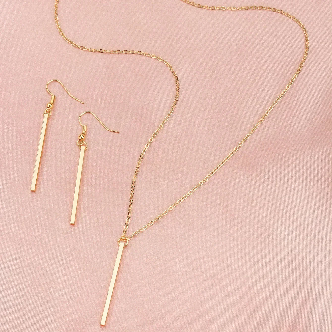 “Elegant Gold Stick Jewelry Set - Necklace & Earrings for Women.”