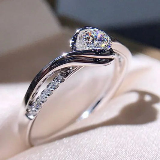 “Elegant 925 silver promise ring with solitaire zircon, perfect bridal jewelry.” - Dazzory