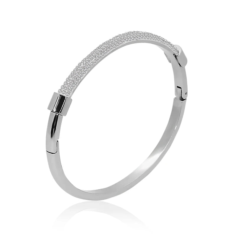 “Trendy titanium steel cuff bracelet with cubic zirconia, classic circular design.”