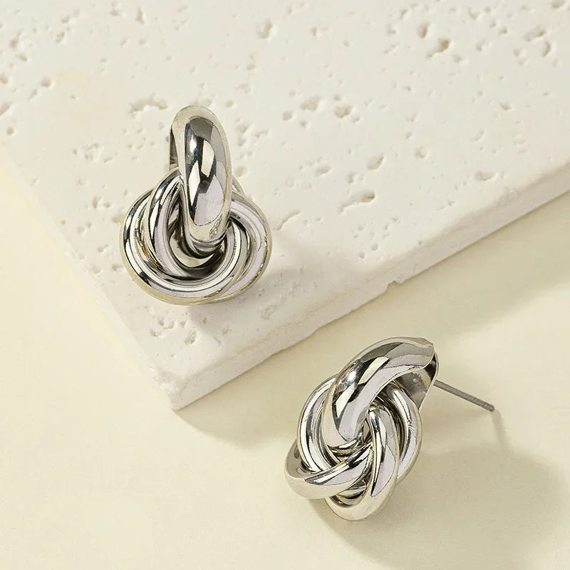 “Gold & Silver Knot Hoop Earrings – Trendy Twist Design, Shiny Plating for Daily Wear”