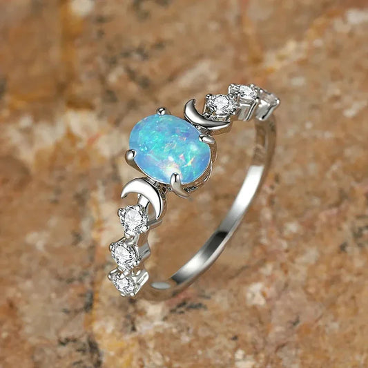 “Blue/white imitation opal moon rings, elegant wedding and anniversary jewelry gifts.” - Dazzory