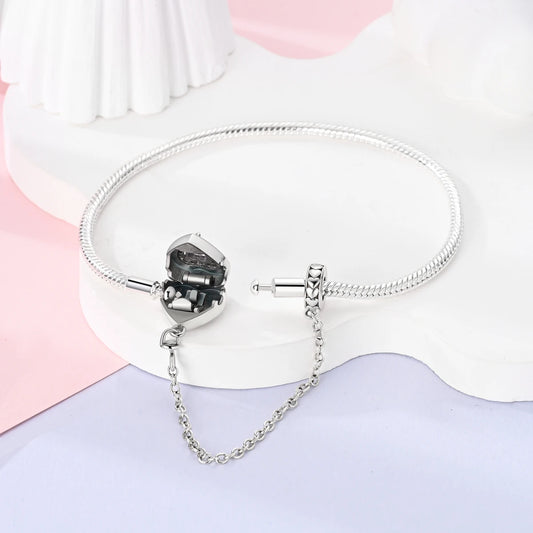 “Silver plated charm bracelet with safety chain, snake chain fits beads, perfect gift.”