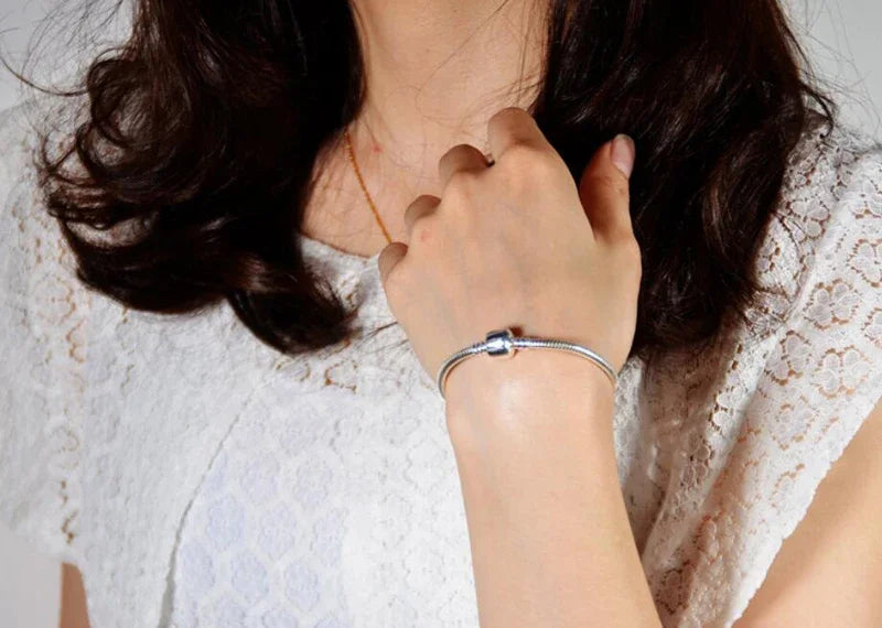“Luxury Handmade 925 Sterling Silver Charm Bracelet - Smooth Snake Bone Design.”