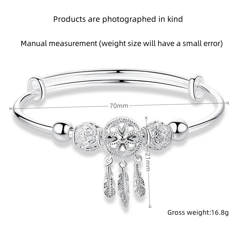 “Silver-Plated Dreamcatcher Bracelet: Elegant Leaves, Tassels, and Beads for Timeless Style.”
