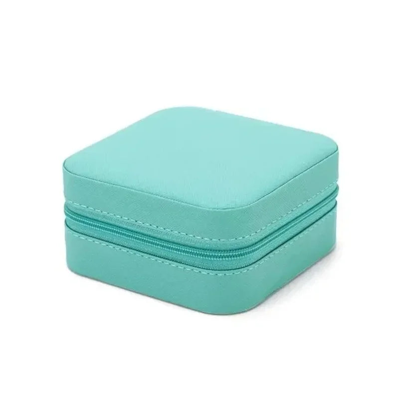 “Portable mini jewelry storage box, PU leather, for earrings, necklaces, rings.”
