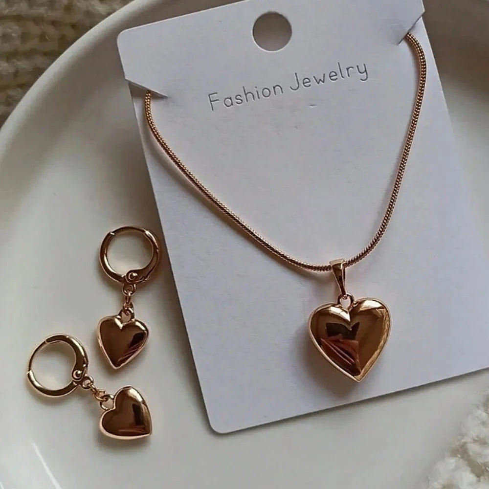“Glossy Gold-Plated Love Heart Earrings & Necklace Set - Simple Dainty Jewelry for Women.”