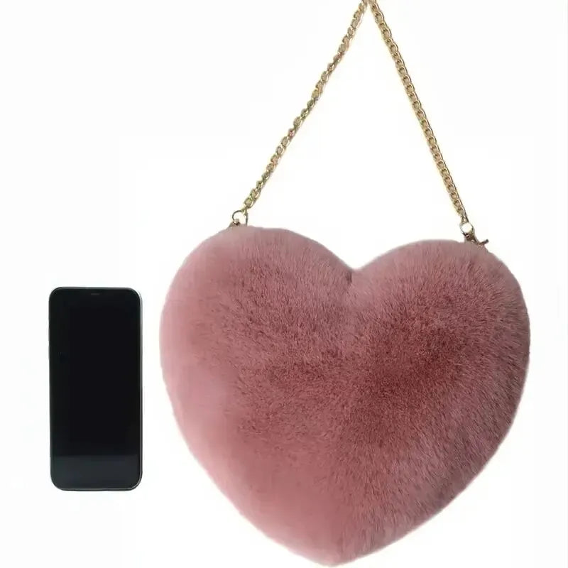 “Heart-shaped fluffy handbag, chain crossbody, cute zipper, perfect for Valentine’s Day.”
