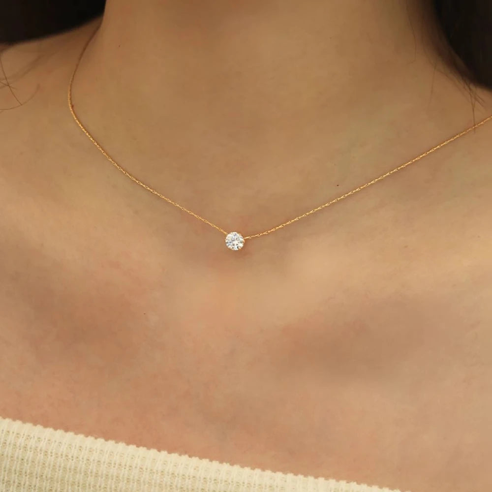 “Stainless Steel Gold Plated Zircon Necklace - Dainty Minimalist Clear CZ Charm for Women.”