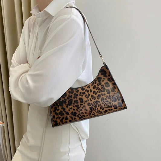 “Trendy zebra-print shoulder bag, PU leather, chic design, perfect summer accessory.”