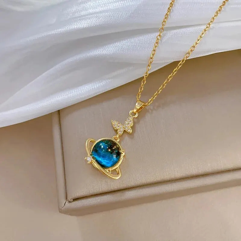 “Luxury gold titanium steel necklace with planet, moon, astronaut pendants.”