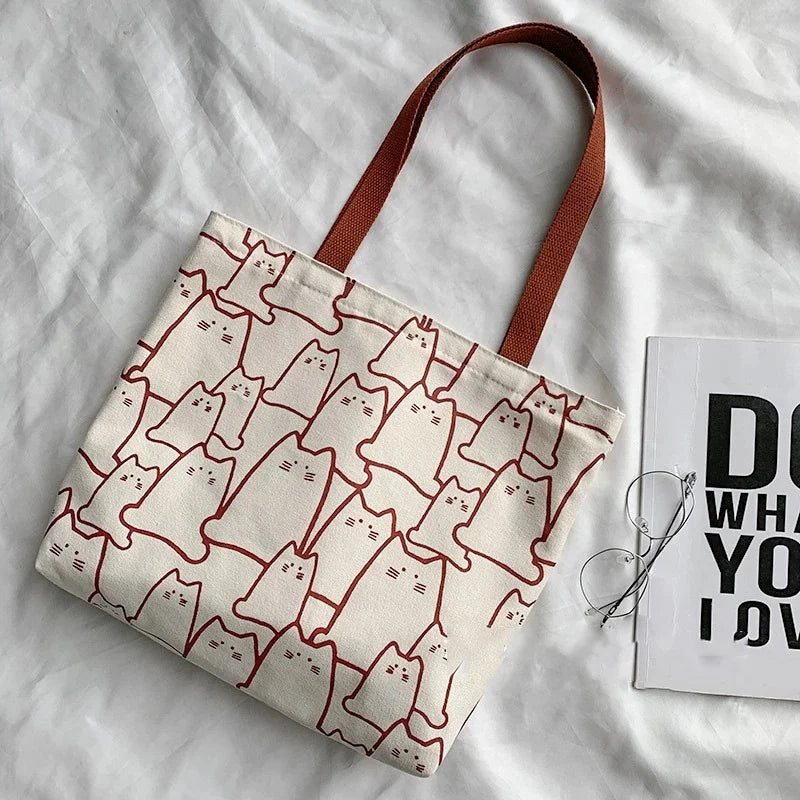 “Canvas tote bag for women, cute cat design, zipper, small Japanese style.”