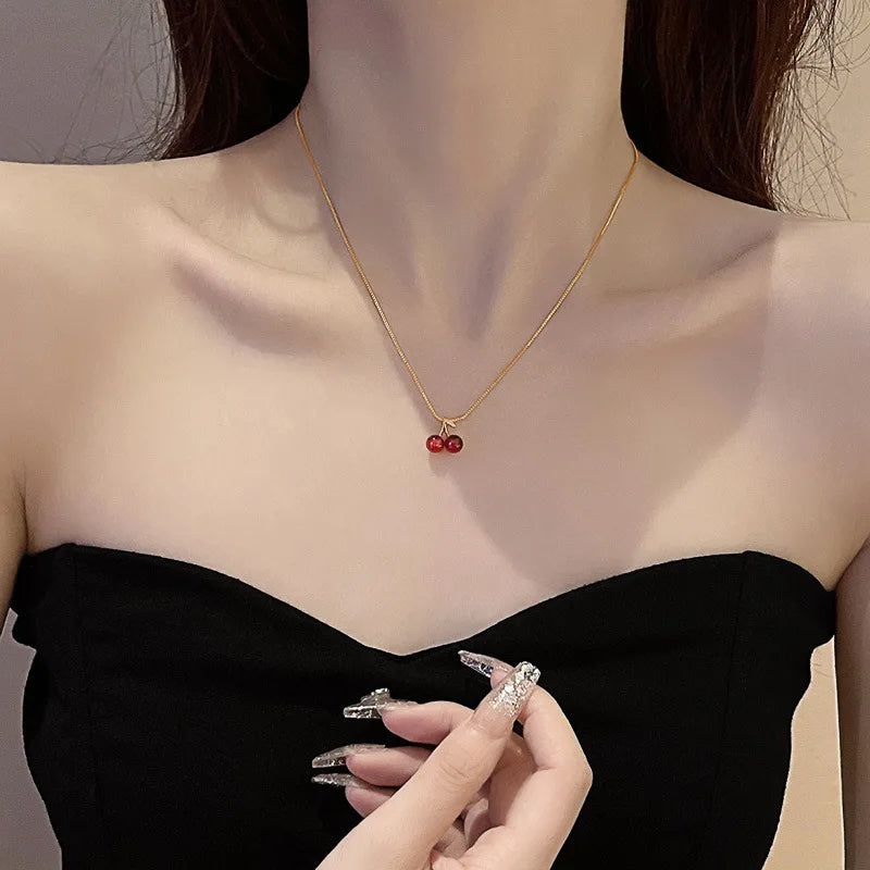 “Stainless Steel Wine Red Cherry Pendant Necklace - Gold Color, Fashion Jewelry for Women.”