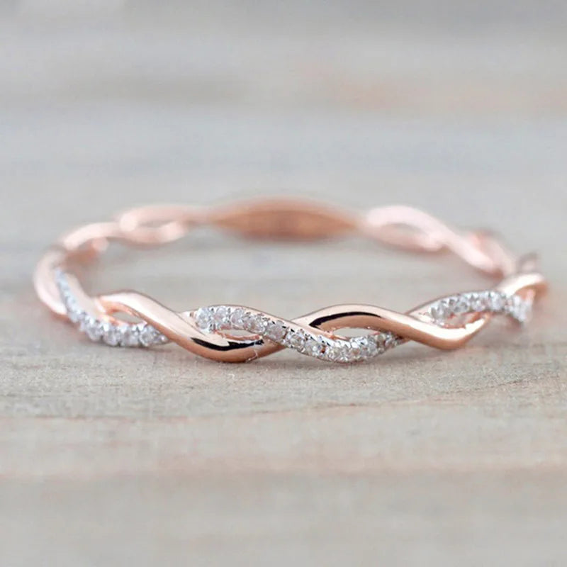 “Huitan Simple Stylish Thin Rings - Twist Band with Shiny CZ for Daily Wear.”