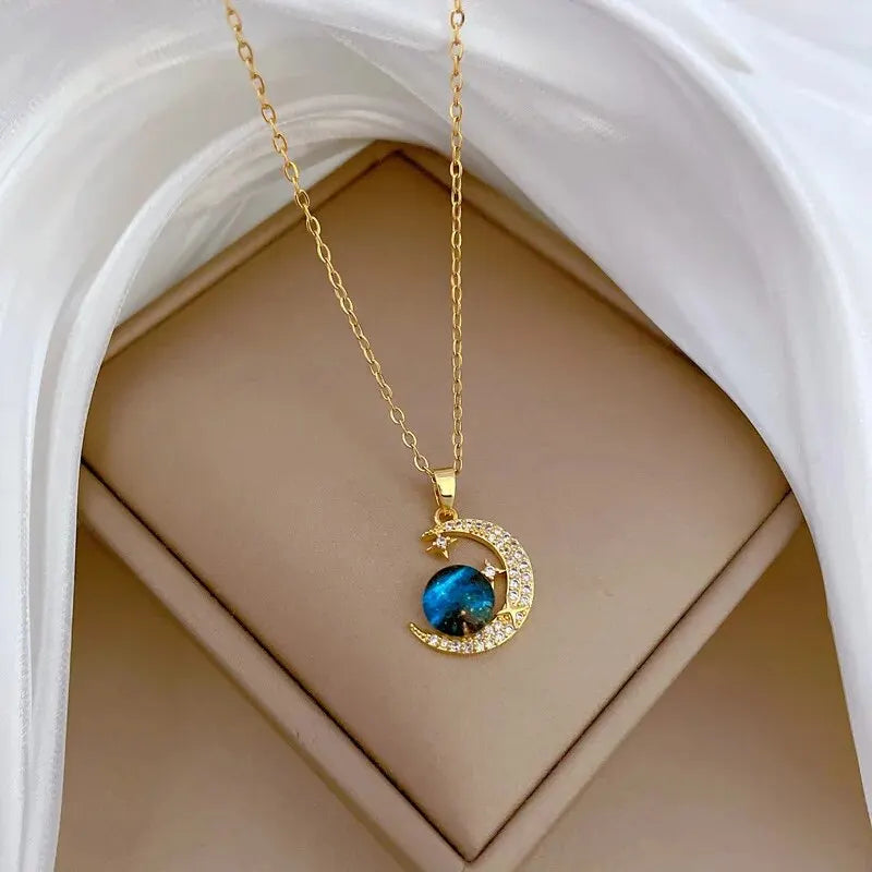 “Luxury gold titanium steel necklace with planet, moon, astronaut pendants.”