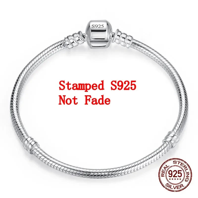 “Luxury Handmade 925 Sterling Silver Charm Bracelet - Smooth Snake Bone Design.”