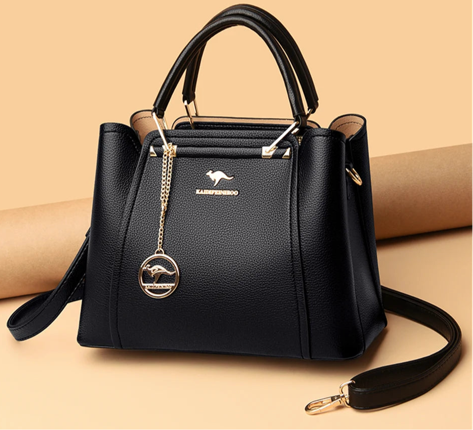 “Luxury women’s designer leather handbag, 3 layers, large capacity, shoulder crossbody tote.” - Dazzory 