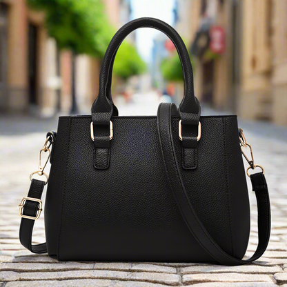“Embroidered leather handbag for women with hairball detail, stylish and versatile.”