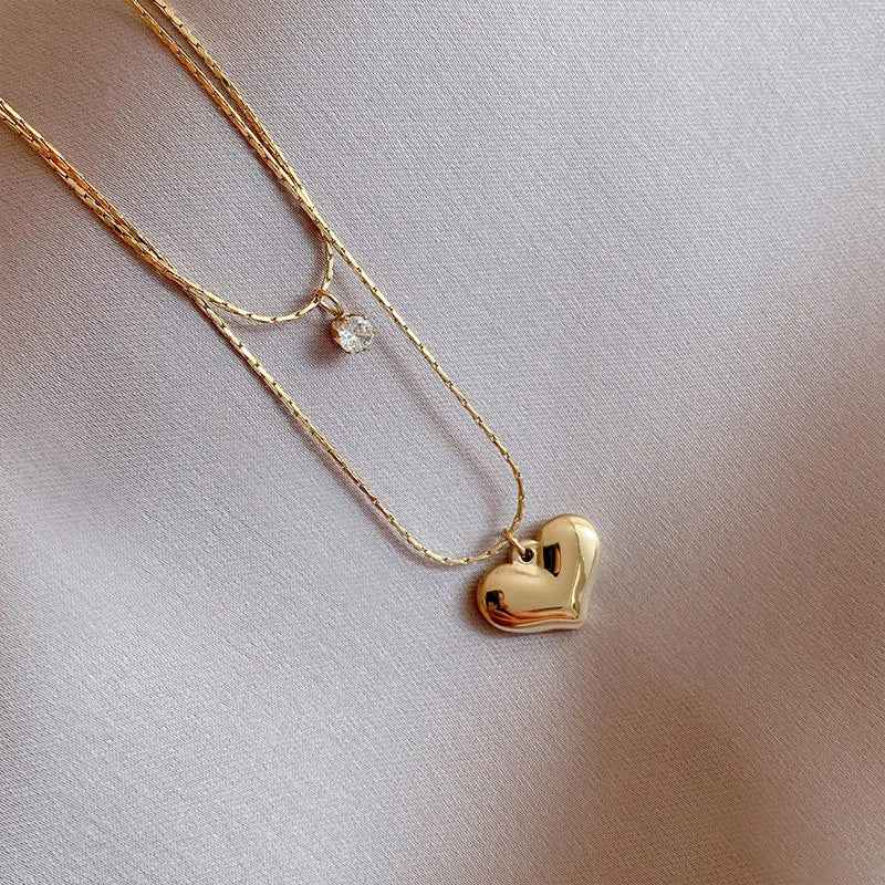 “XIYANIKE 316L Stainless Steel Double Layer Heart Pendant Necklace - Trendy Choker for Women.”