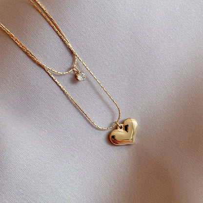 “XIYANIKE 316L Stainless Steel Double Layer Heart Pendant Necklace - Trendy Choker for Women.”