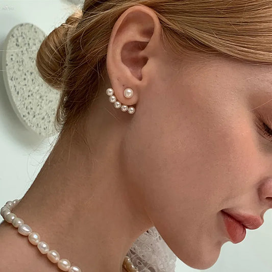 “New imitation pearl stud earrings with geometric crystal zircon stars, perfect for parties.”