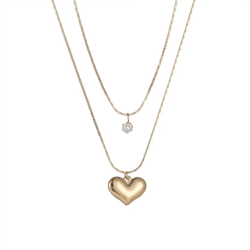 “XIYANIKE 316L Stainless Steel Double Layer Heart Pendant Necklace - Trendy Choker for Women.”