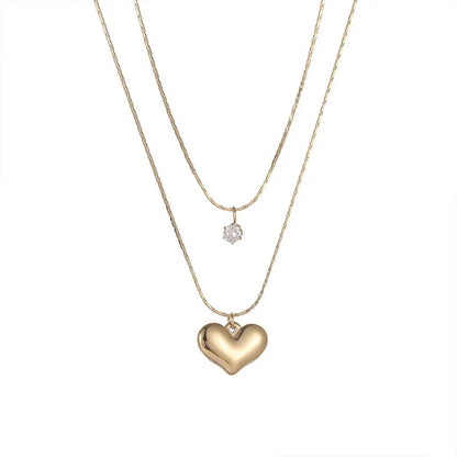 “XIYANIKE 316L Stainless Steel Double Layer Heart Pendant Necklace - Trendy Choker for Women.”