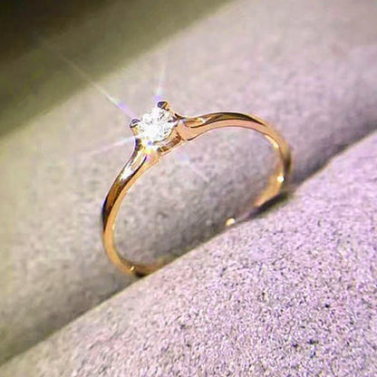 “Minimalist wedding ring with 4MM cubic zirconia, simple and elegant design.”