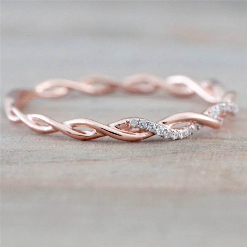 “Huitan Simple Stylish Thin Rings - Twist Band with Shiny CZ for Daily Wear.”