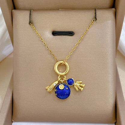 “Luxury gold titanium steel necklace with planet, moon, astronaut pendants.”