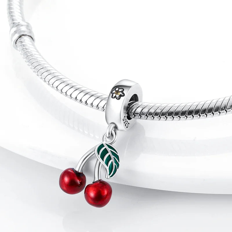 “Red enamel cherry charm beads for bracelet, necklace, keychain, DIY jewelry gift.”