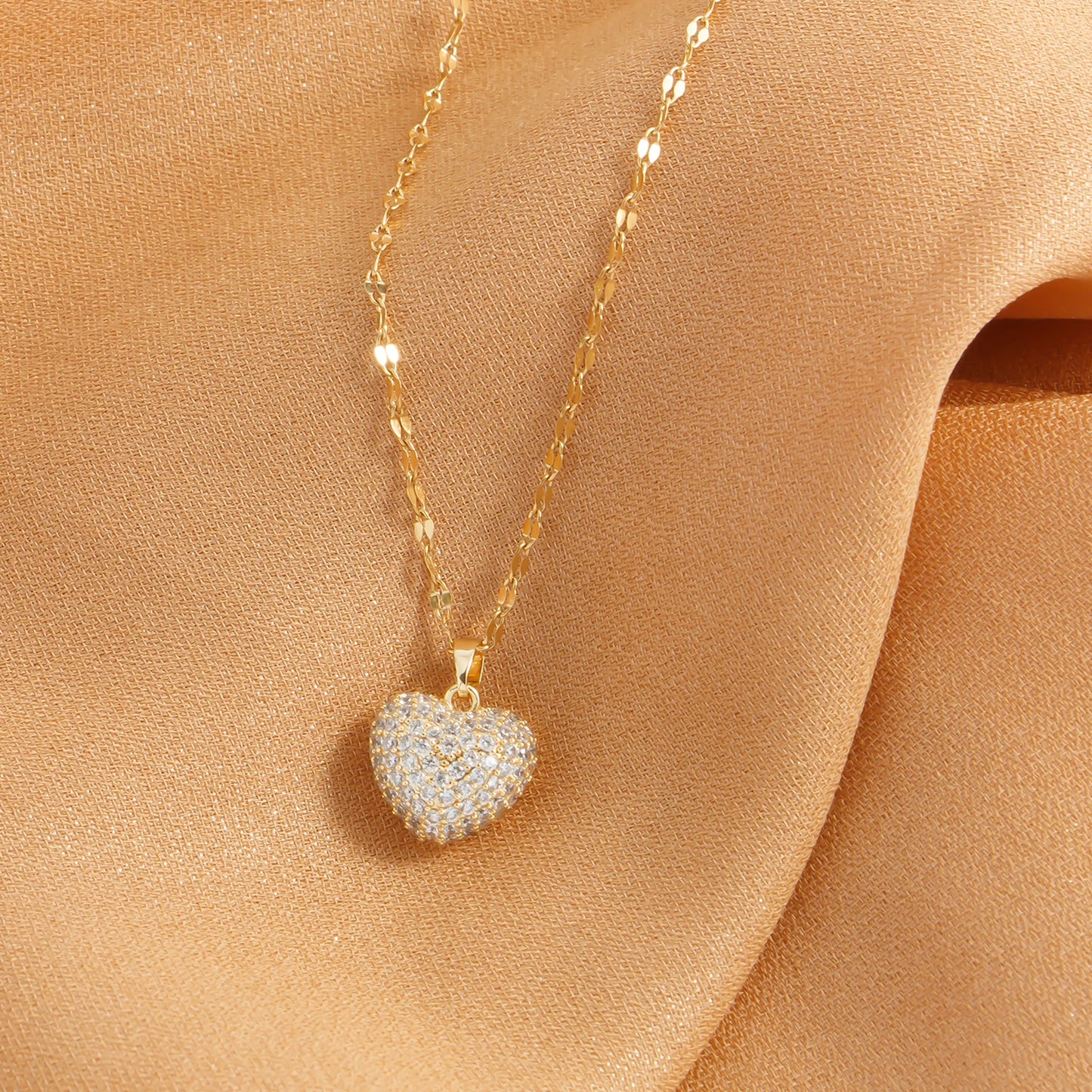 “Cubic Zirconia Heart Pendant Necklace - Gold-Plated Stainless Steel for Women.”