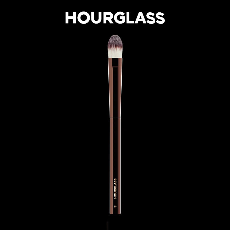 “Large concealer brush, soft fiber hair, flawless coverage, stylish makeup tool.”