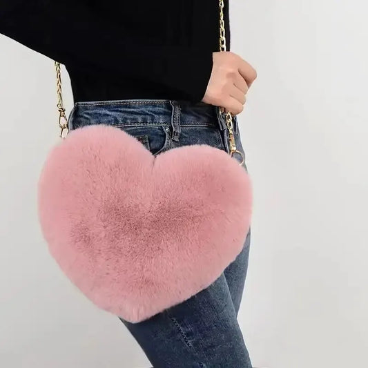 “Heart-shaped fluffy handbag, chain crossbody, cute zipper, perfect for Valentine’s Day.”