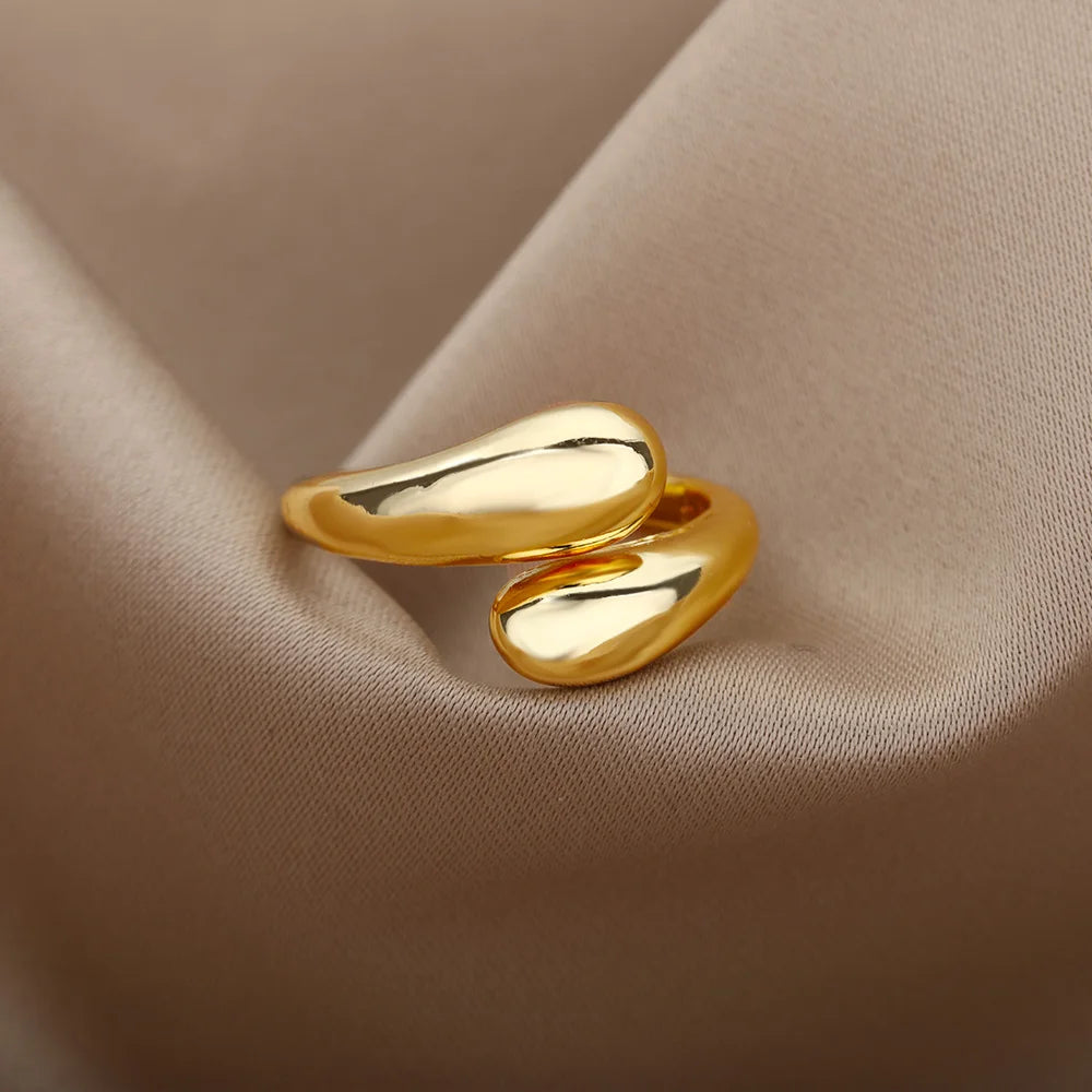 “Trendy Gold Stainless Steel Rings for Women - Perfect Wedding & Couple Jewelry.”