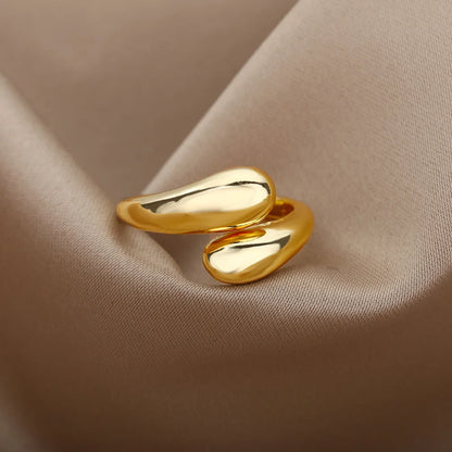 “Trendy Gold Stainless Steel Rings for Women - Perfect Wedding & Couple Jewelry.”