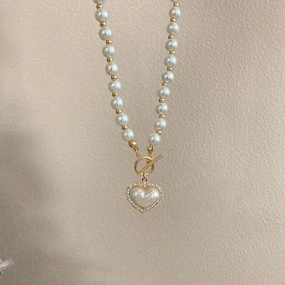 “Elegant Pearl Necklace for Women - Heart Pendant, Luxury Imitation Pearls, Korean Jewelry.”
