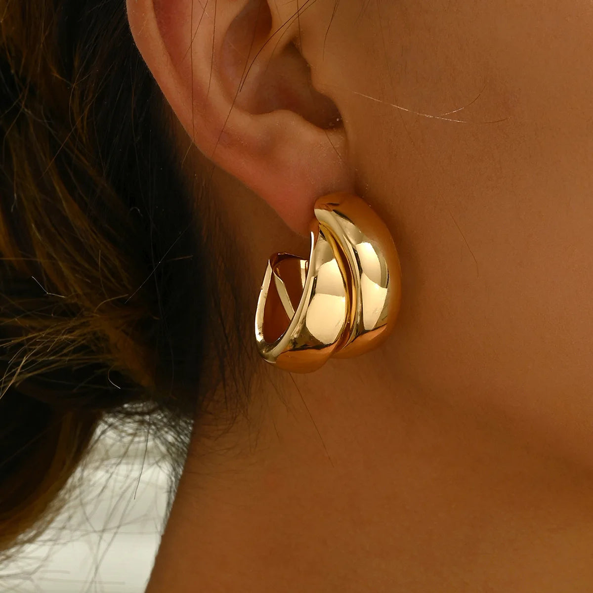 “Stainless Steel Chunky Hoop Earrings - Gold Double Ring Geometric Design.”