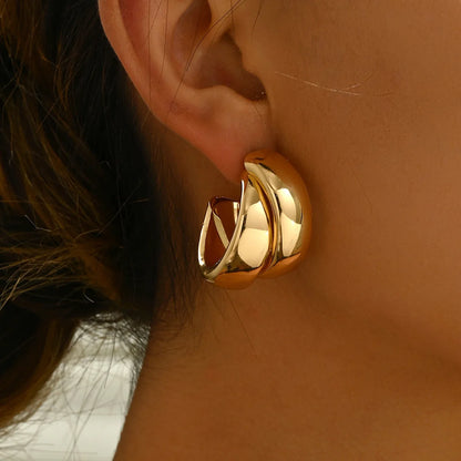 “Stainless Steel Chunky Hoop Earrings - Gold Double Ring Geometric Design.”