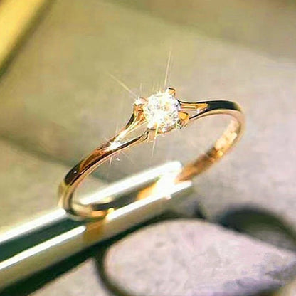 “Minimalist wedding ring with 4MM cubic zirconia, simple and elegant design.”