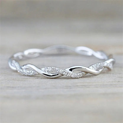 “Huitan Simple Stylish Thin Rings - Twist Band with Shiny CZ for Daily Wear.”