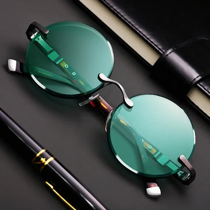 “Classic rimless sunglasses, retro round design, crystal green lenses for outdoor wear.”
