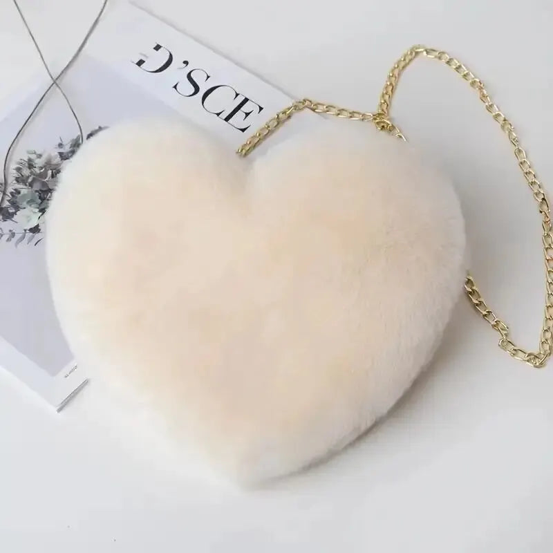 “Heart-shaped fluffy handbag, chain crossbody, cute zipper, perfect for Valentine’s Day.”