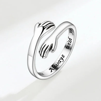 “Romantic Heart Hand Hug Ring - Adjustable Couple Ring for Wedding & Dating.”
