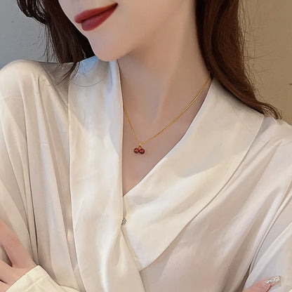 “Stainless Steel Wine Red Cherry Pendant Necklace - Gold Color, Fashion Jewelry for Women.”