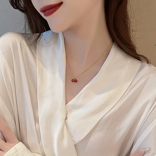 “Stainless Steel Wine Red Cherry Pendant Necklace - Gold Color, Fashion Jewelry for Women.”