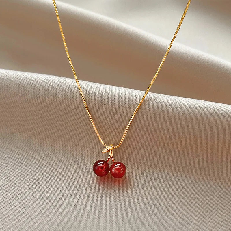 “Stainless Steel Wine Red Cherry Pendant Necklace - Gold Color, Fashion Jewelry for Women.”